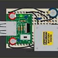 Computer Circuit Board Component With Red Capacitors Metal Casing And Warning Label 3d model