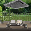 Outdoor Sofa Set With Coffee Table And Umbrella On Garden Patio With Green Plants