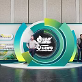 Popular Photo Check-in Spot With Circular Green Blue Structure Central Logo And Decorative Backdrop