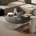 Elegant Black Glass Coffee Table With Cylindrical Legs And Decorative Glassware