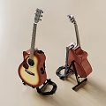 Two Acoustic Musical Instruments With Wooden Bodies On Black Stands For