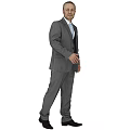 A Man Standing in Gray Suit with White Shirt and Black Vest on Gray Background