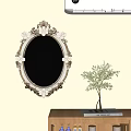 Ornate Oval Mirror with Floral Decorations Hanging on Light Wall Beside Green Plant Vase
