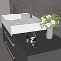 Modern White Ceramic Sink With Chrome Faucet On Dark Countertop And Flower Vase