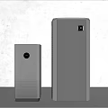 Modern Black Speakers With Minimalist Design Two Sizes Tall And Short Textured Surface White Background