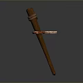 Brown Wooden Stick With Red Strap Tied Around Middle Section