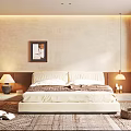 Cozy Bedroom With Textured Beige Walls Framed Artwork Bedside Lamps Wooden Flooring And Area Rug