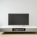 Modern White and Gray TV Stand With TV on Top and Storage Space for Electronics