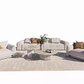 Modern Sofa Set With Light Colored Pillows Round Coffee Table Potted Plant And Area Rug
