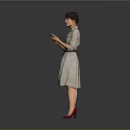 Woman Holding Phone In Light Colored Dress With Belt And Red High Heels Gray Background
