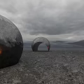 Mysterious Commercial Landscape With Large Arched Structure Barren Ground And Gray Sky