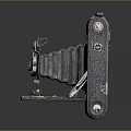 Vintage Folding Camera With Leather Cover Metal Body And Retro Design