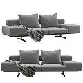 Comfortable Gray Sofa With Plush Cushions And Striped Blanket Design 3d model