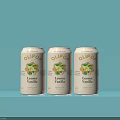 Refreshing OLIPOP Lemon Vanilla Beverage Cans Displayed on Light Blue Background