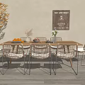 Wooden Dining Table Set with Rattan Chairs Decorative Sign and Yellow Foliage Plant