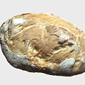Freshly Baked Artisan Bread With Golden Crust And Textured Scored Surface