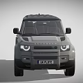 Grey Land Rover Defender SUV With Black Roof And UK License Plate