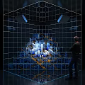 A person observing illuminated city model within transparent cube grid structure with lights 3d model