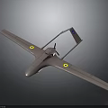 Gray Unmanned Space Drone With Yellow Wing Markings Blue Tail Emblem And Aeronautical Design
