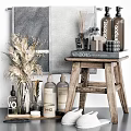 Elegant Bathroom Accessories Arranged with Grey Towel Dried Flowers Toiletries and Candle on Wooden Stool