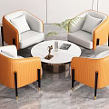 Modern Orange and White Leather Sofa and Round Coffee Table Set with Decorative Plant