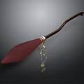 Red Pleated Brush With Brown Long Handle And Golden Decoration On Dark Background