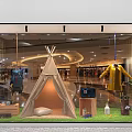 Shopping Mall Window Display With Teepee Yellow Coat Wooden Boxes Green Grass And Plants