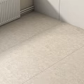 Natural Textured Light Beige Floor Tiles In Indoor Room With White Walls