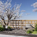 Wooden Garden Wall with Blooming Tree Stone Mill Gravel and Green Plants Under Blue Sky