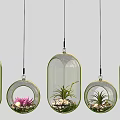 Multiple Hanging Transparent Glass Pendant Lights With Plants And Pink Flowers