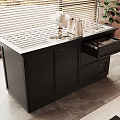 Black Cabinet With Open Drawer And Items On Top Near Window Blinds And Plant
