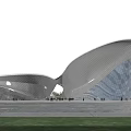 Modern Museum Building Featuring Curved Silver Metal Structure and Glass Facade under Pink Cloudy Sky