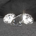 Oval Transparent Sparkling Diamonds With Brilliant Cut Facets On Black Background