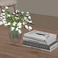 Transparent Vase with White Tulips on Wooden Table and Fashion Books