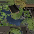 Rockery Stones In Traditional Garden With Lush Green Plants And Pond