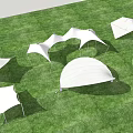 Modern Tensile Membrane Structures In Various Shapes On Green Grass Field