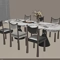 Round Marble Dining Table With Gray Chairs And Flower Vase Centerpiece Decoration