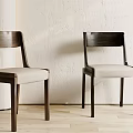 Modern Minimalist Dining Chairs With Dark Wooden Frames And Light Colored Seats 3d model
