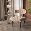 Beige Tufted Single Sofa With Side Table And Green Plant In Cozy Room