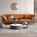 Modern Brown Leather Sofa Round Coffee Table Set With Orange Gray Pillows Wall Decor Rug
