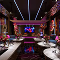 Luxury KTV Interior With Colorful Lighting Large Screens Comfortable Seats And Floral Decorations