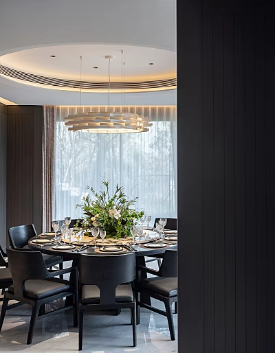 Modern Restaurant Dining Space With Round Table Black Chairs Flower Centerpiece Chandelier And Window View 3d model