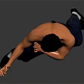 Man Performing Martial Arts Action In Black Vest And Blue Pants Against Gray Background