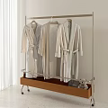 Soft Lightweight Robes Hanging on Metal Clothing Rack with Wooden Shelf and Plush Toy
