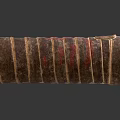 Vintage Handcrafted Cylindrical Container With Layered Brown Red Yellow Stripes And Textured Surface