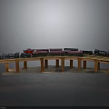 Model Train on Curved Wooden Track with Colorful Carriages and Support Pillars