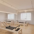 Bright Pilates Studio With Multiple Reformers Wooden Flooring And Large Windows