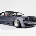 Gray Luxury Sedan With Large Chrome Wheels Black Grille And Elegant Design