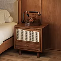 Wooden Nightstand With Rattan Drawer And Vintage Telephone On Bedroom Side