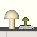 Modern Green And White Mushroom Shaped Table Lamps On Books And Table